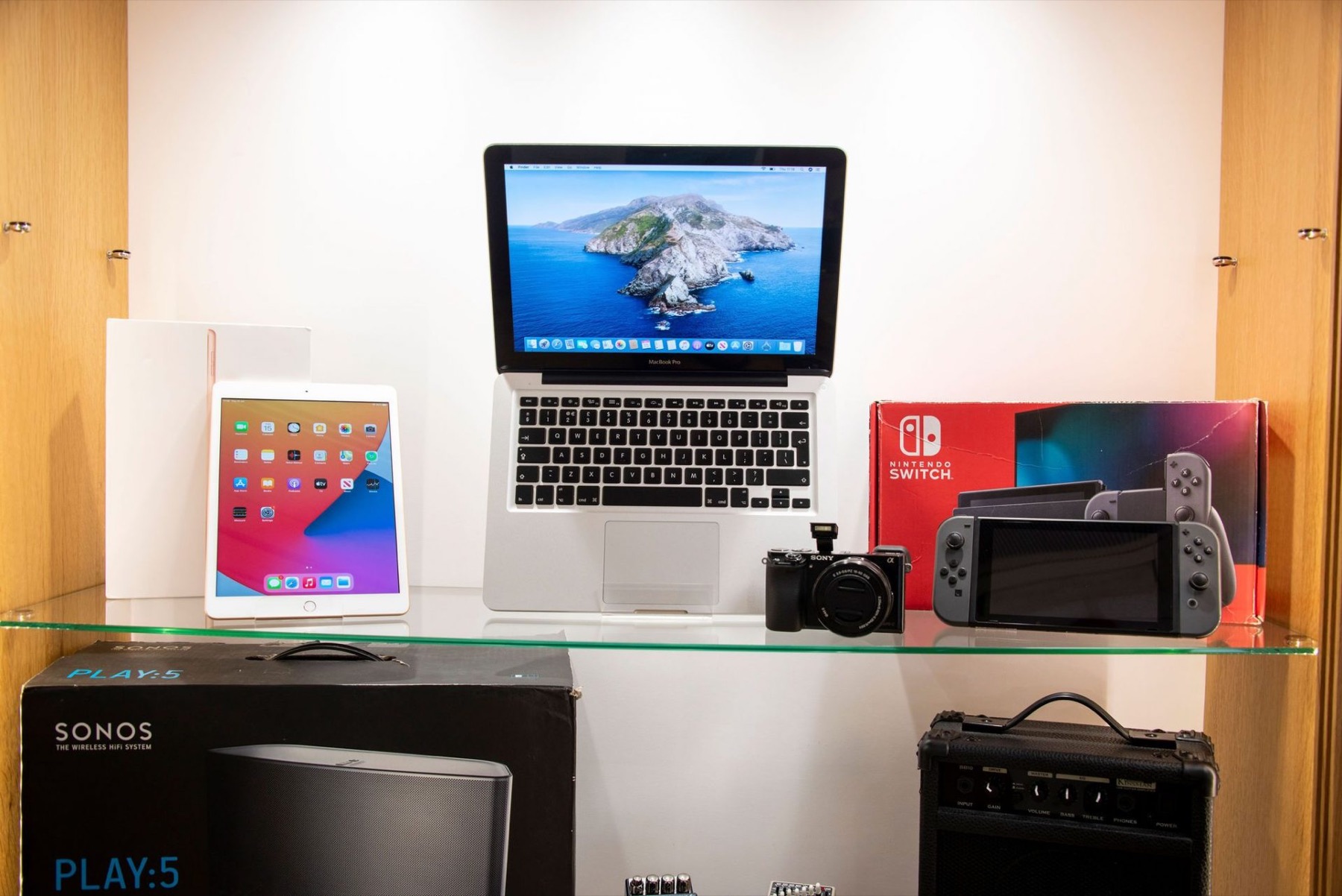 Electricals on display: laptop, tablet, camera and console