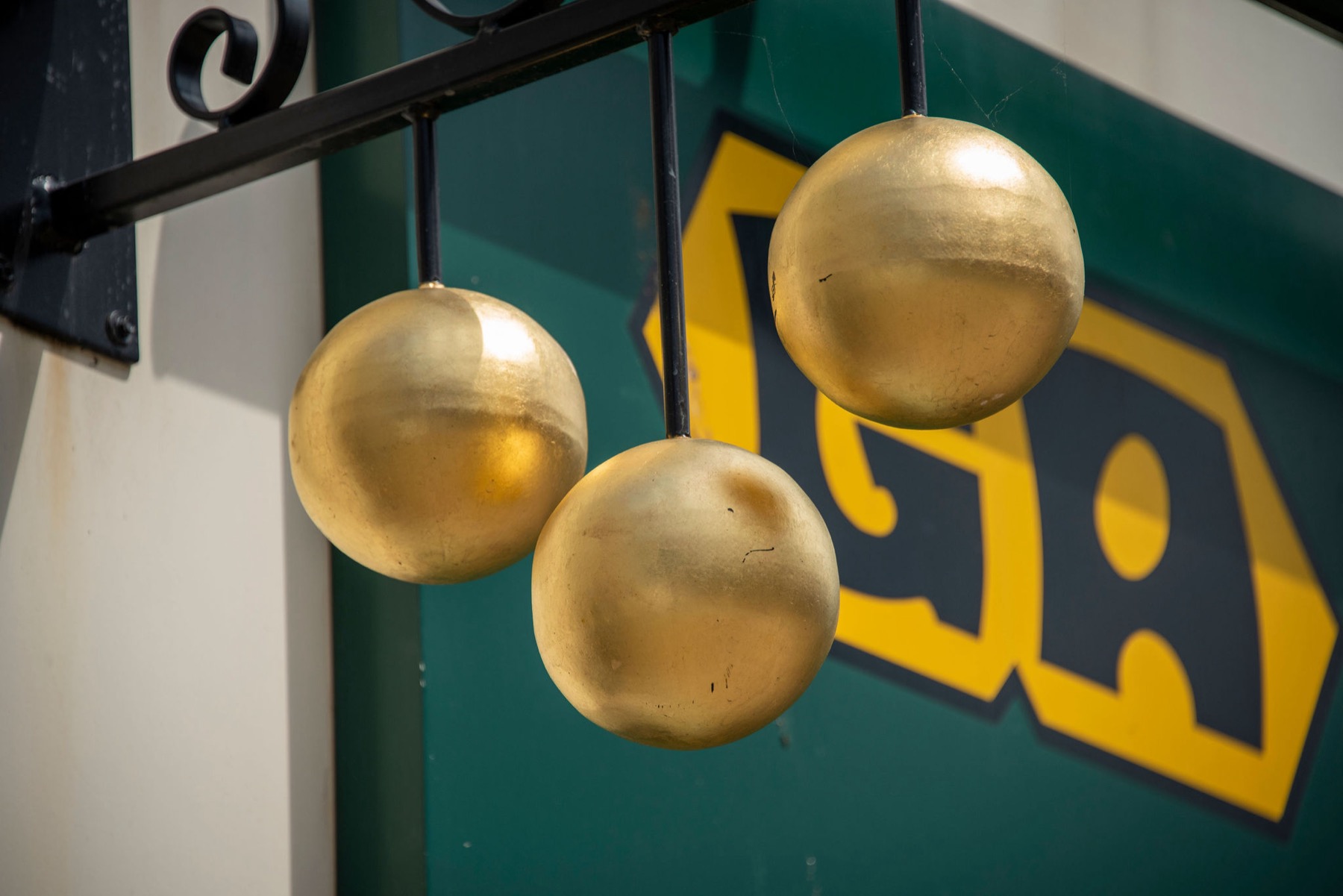 The three golden balls of the pawnbroker hanging outside the GA shopfront